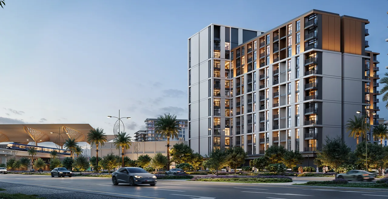 Terra Woods at Expo Living — dusk exterior of mid-rise tower near transit station