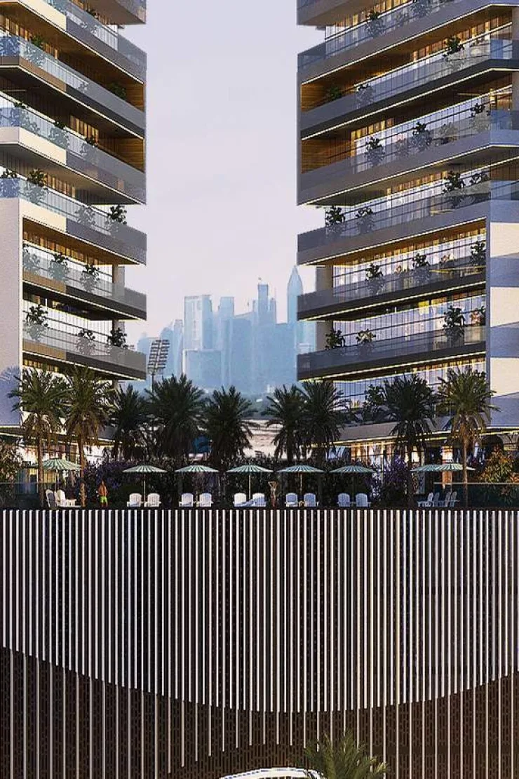 Noble Crest Residences — dusk view between the two towers, podium palms and vertical-fin podium